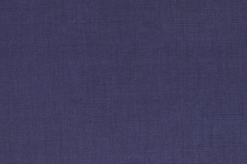 Fototapeta na wymiar The texture of dark blue fabric for clothing.