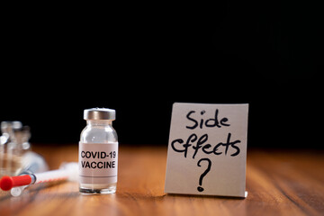 Concept of Coronavirus covid-19 vaccination side effects doubts and questions showing with vaccine...