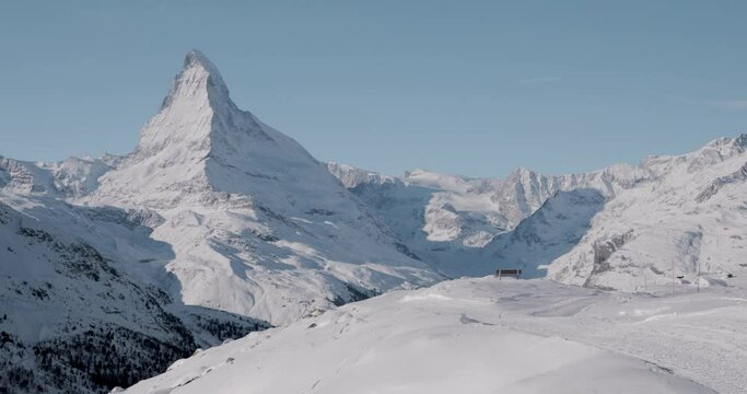 The Matterhorn face east and face north in morning light in winter, Video taken from the hiking trail from Blauherd to Fluhalp, above Zermatt in Valais, Switzerland.
