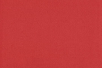 Clean red retro paper background. Vintage cardboard texture. Grunge paper for drawing. Simple blank fabric pattern.
