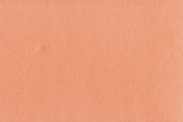 Clean red retro paper background. Vintage cardboard texture. Grunge paper for drawing. Simple blank fabric pattern.