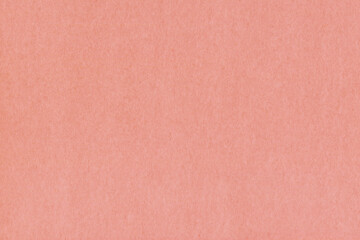 Clean red retro paper background. Vintage cardboard texture. Grunge paper for drawing. Simple blank fabric pattern.