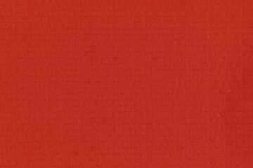Clean red retro paper background. Vintage cardboard texture. Grunge paper for drawing. Simple blank fabric pattern.