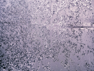 Frosty winter patterns on window glass. Close-up.