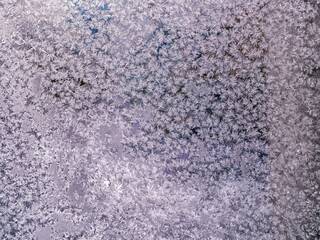 Fototapeta na wymiar Frosty winter patterns on window glass. Close-up.