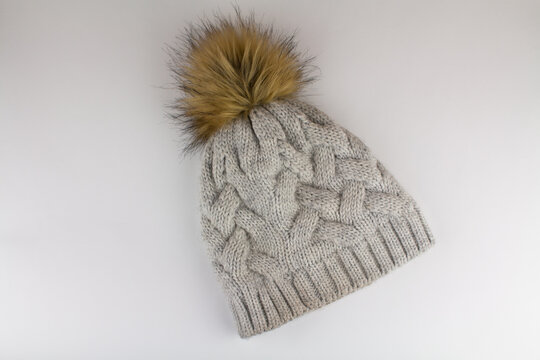 beautiful knitted winter hat on a white background