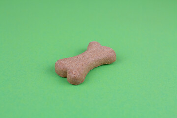 dog food bones on green background pattern
