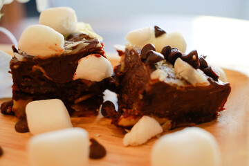 Homemade cookies brownie and marshmallow with cocktails punch served on wooden table.