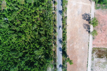 The Road city forest sea bay aerial top view UAV