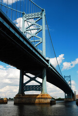 The Ben Franklin Bridge spans the Delaware River in  Philadelphia, connecting it with New Jersey