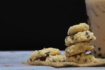 Cookie raisin put on sack with ice milk tea boba bubble  with black background, homade cooking dessert and food