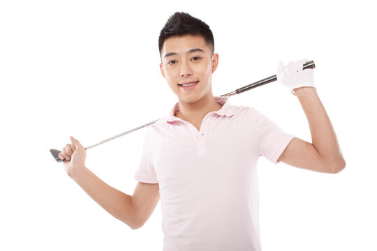 Portrait of young Male golfer with club over shoulder