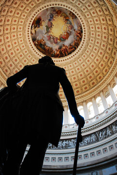 A statue of George Washington stands in the Capitol Rotunda in Washington DC