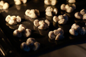 Thai Traditional Dessert Homemade Cookies "Khanom Kleeb Lumduan" look like Flowers. Ready to Baked in Stove.
