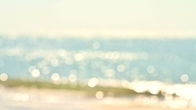 Abstract bokeh background from summer blue sea water at the beach