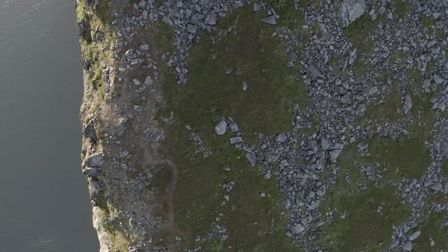 Impressive cliff taken from above during the sunset, Segla mountain,Norway