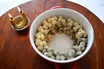 Thai Traditional Dessert Homemade Cookies "Khanom Kleeb Lumduan" In Pot with Smoke candle Process.