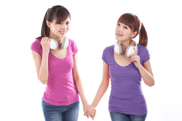 Portrait of two female friends weating earphone