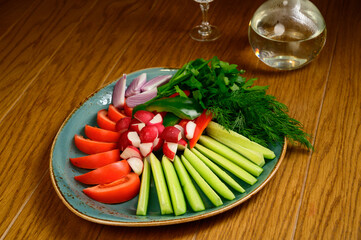 Fresh chopped vegetables on a wooden table.Top view
