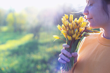 girl holding a bouquet of tulips