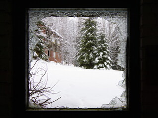 It's cold outside - Winter scenery through a broken window