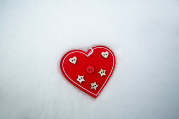 wooden photo frame heart lies on the snow