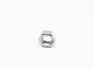 Closeup of a metal nut under the lights isolated on a white background