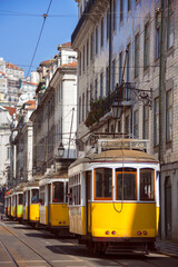 Fototapeta na wymiar Many yellow tramways parked in one of the main streets of the city of Lisbon. Portugal.