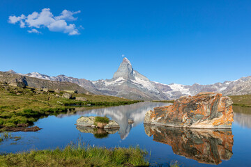 Naklejka na ściany i meble Matterhorn reflected in the Stellisee, Zermatt, Valais, Switzerland