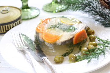 Jellied sturgeon with lemon, olives and glasses of white wine