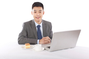 Portrait of young bisinessman sitting in the front of laptop 