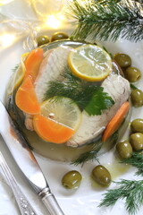Jellied sturgeon with lemon, olives and glasses of white wine