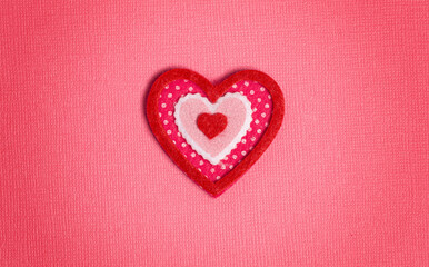 Obraz premium Simple Background with Felt Love Hearts on Pink Background