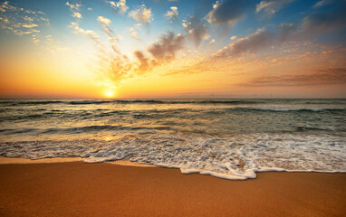 Naklejka na ściany i meble Landscape with sea sunset on beach.