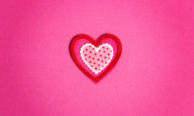 Simple Background with Felt Love Hearts on Pink Background