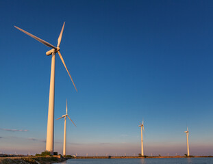 Wind turbines generating power in Copenhagen's harbour, Denmark