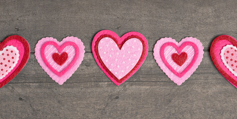 Simple Background with Felt Love Hearts on a Wood Table