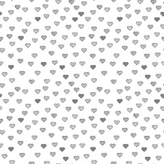 Seamless background with black hearts on white background, for Valentine's day, doodling.