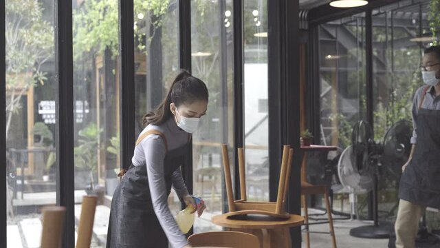 employees wear a medical face masks and preparing to reopen the restaurant
