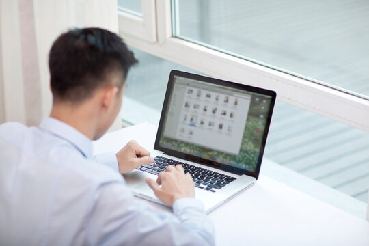 Portrait of young bisiness man with laptop