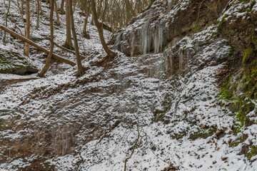 Fototapeta na wymiar Winter waterfall near Moravsky Krumlov town in winter cold morning