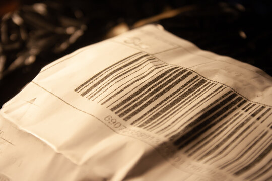 Closeup bar code on courier package label. Shipment code. Delivery