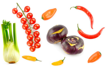 Cherry tomatoes, chili peppers, kohlrabi and fennel bulb isolated on white.