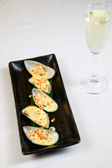 Oysters with red caviar on white background