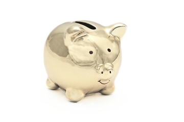 Golden piggy bank isolated on white background with copy space. 