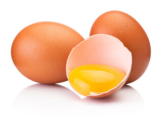 Two brown raw eggs and one is broken isolated white on white background