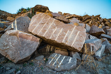 Stone materials near old flooded stone quarry