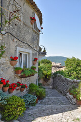 A narrow street between the stone houses of Morcone, an old town in the province of Benevento,...