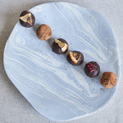 A plate of gourmet chocolates minimalistic concept
