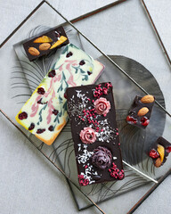 Handmade chocolate. Top view on various sweets on white table. Small business, handmade candies concept. minimalistic concept